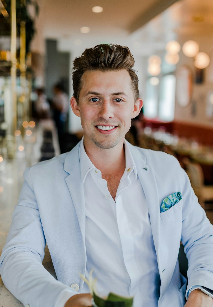 Smiling real estate consultant in a light business jacket